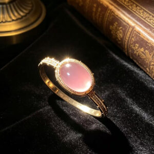 vintage lustrous natural rose quartz bangle hand woven craftsmanship elegant healing aesthetic statement bracelet